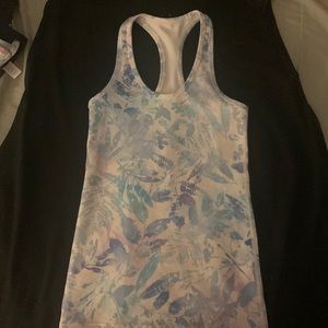 Ivivva size 10 racerback tank in pastel pink, purple and blue floral pattern